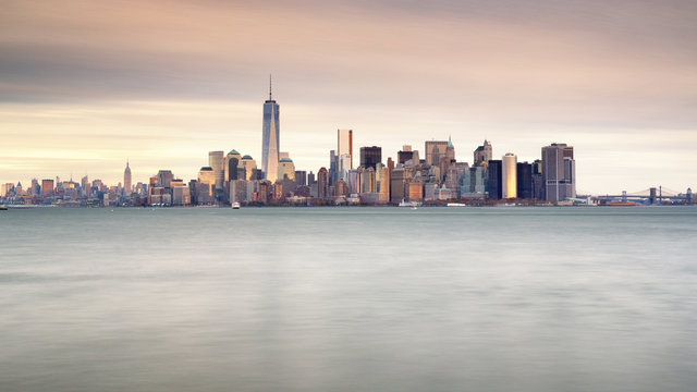 Manhattan skyline with Freedom Tower at sunrise, New York City, USA