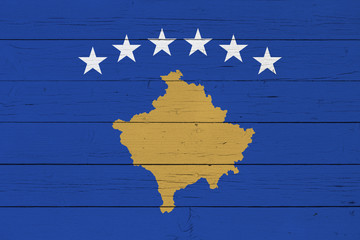 Flag of Kosovo on wooden background
