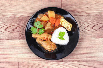 Rice with boiled chicken,omelet roll topped Japanese yellow curr