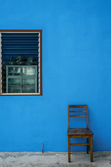 Fototapeta na wymiar windows and Detail of house exterior blue wall