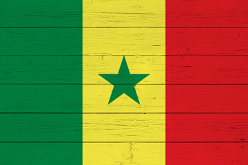 Flag of Senegal on wooden background