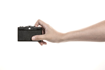 Two hands hold a vintage(old, classic) camera isolated white. 