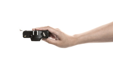 Two hands hold a vintage(old, classic) camera isolated white. 