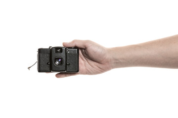Two hands hold a vintage(old, classic) camera isolated white. 