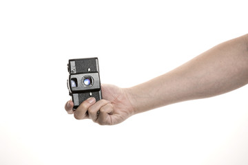 Two hands hold a vintage(old, classic) camera isolated white. 