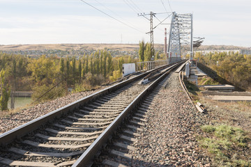 Fototapeta na wymiar Rails running on a railway bridge across the Volga-Don canal, Volgograd