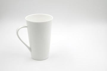 white cup on white background with copy space on right