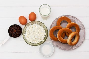 Foodstuffs for dessert on a white table.