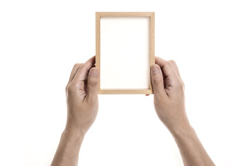Two hands hold a photo(picture) wood frame isolated white.