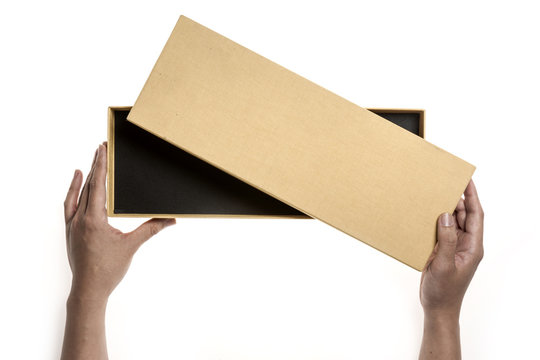 Two hands hold a empty(blank) yellow gift box and open isolated white