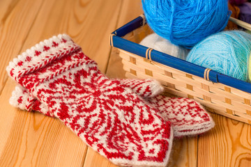 warm mittens knitted with a pattern of skillfully a professional