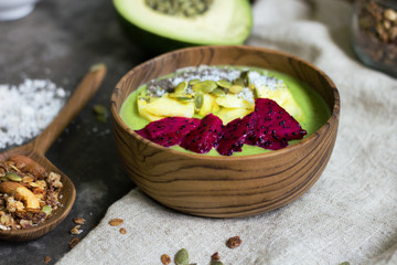 Healthy breakfast with granola and avocado mash