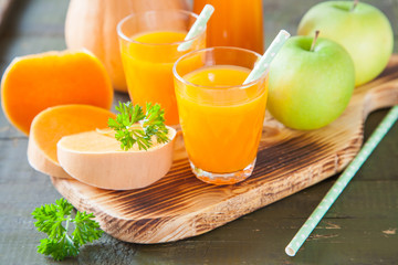 pumpkin apple juice in a glass, selective focus