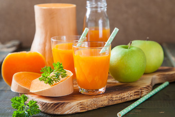 pumpkin apple juice in a glass, selective focus