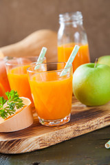 pumpkin apple juice in a glass, selective focus