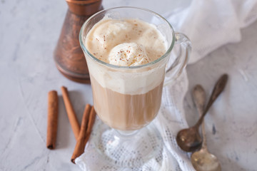 coffee with ice cream in a glass on a table, selective focus