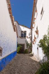 Fototapeta na wymiar Empty street in Obidos, a medieval town in Portugal