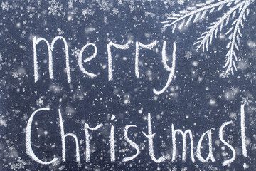 Merry Christmas  hand writing chalk text on black chalkboard