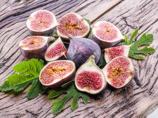 Ripe fig fruits on the wooden table.