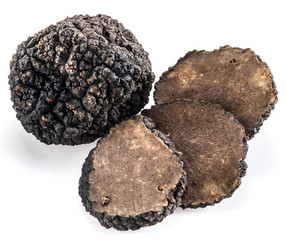 Black truffles isolated on a white background.