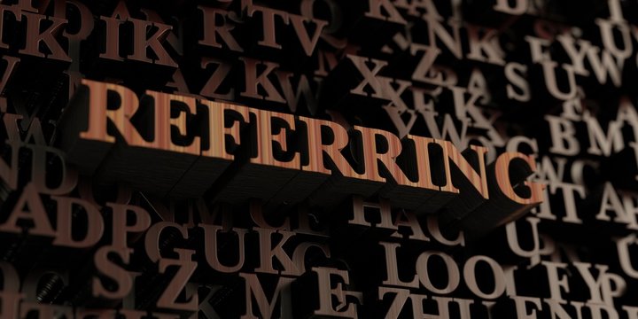 Referring - Wooden 3D rendered letters/message.  Can be used for an online banner ad or a print postcard.