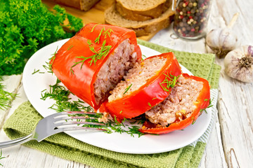 Pepper stuffed meat in plate on board