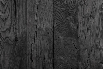 black, charred wooden wall