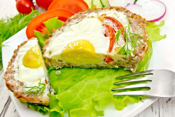 Tartlet meat with egg cut on light board