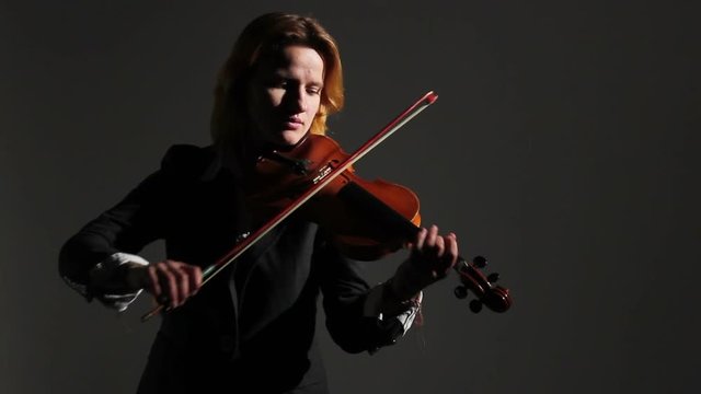 Woman Playing On Violin