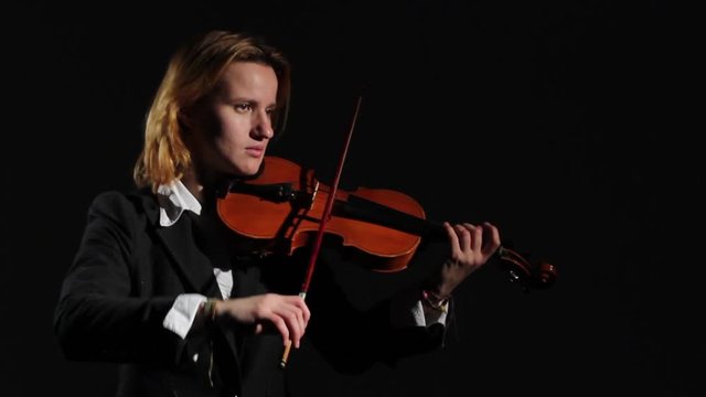 Black Backgraund. Woman Playing On Violin