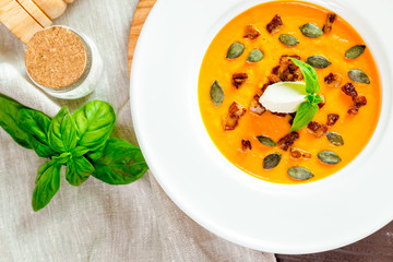 Pumpkin soup in white plate