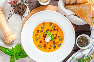 Pumpkin soup in white plate