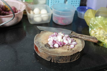 Woman cutting fresh scallions.