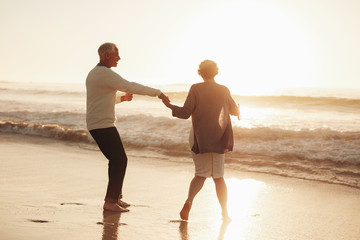 Senior couple having fun at beach