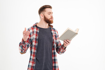 Young bearded man actor reading script