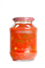 Canned vegetables in glass jars isolated on white background