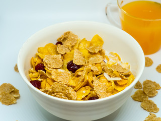 The breakfast cereal topped with dried fruit.