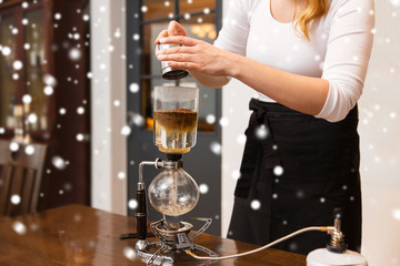 close up of woman with siphon coffee maker and pot