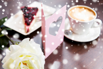 close up of greeting card with heart and coffee