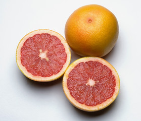 Grapefruit, whole and sliced in two. 
