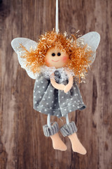 vintage toy angel figurine on wooden table