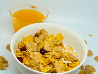 The breakfast cereal topped with dried fruit.