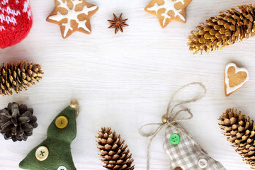 items to decorate the winter holidays/ flat layout with shaped cookies, soft trees and present cones top view 