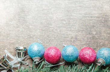 Christmas background with gift boxes and snow on wooden board.