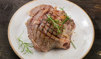 Thick juicy grilled beef steak served on plate