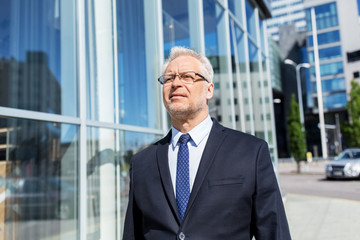 senior businessman on city street