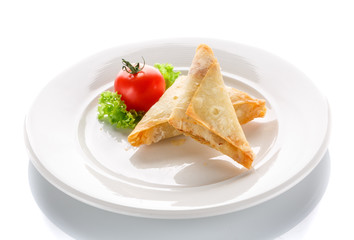 pancakes fried with tomatoes on a white background