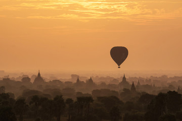 Hot air ballons over pagodas in sunrise at Bagan, Myanmar.