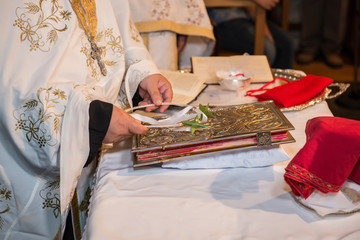 priest in church performing wedding