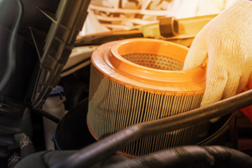 auto mechanic wearing protective work gloves holding a dirty, ai